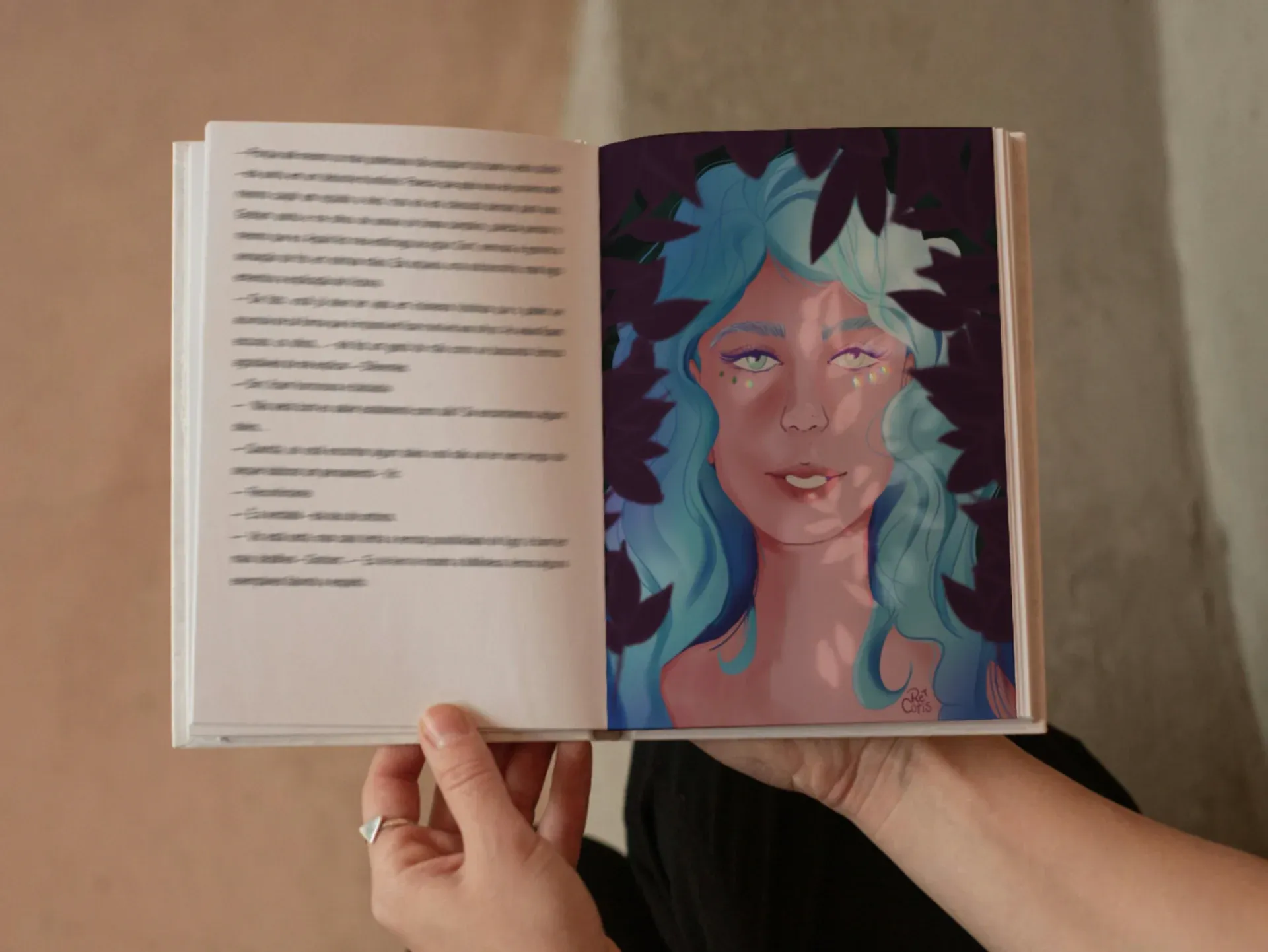 Open book mockup with a vibrant character illustration, representing custom illustration services.